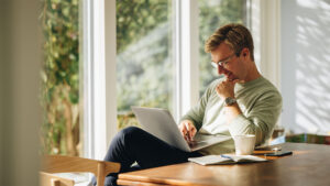 Man thinking on laptop