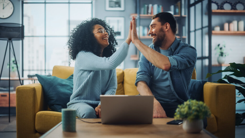 Man and woman giving high five