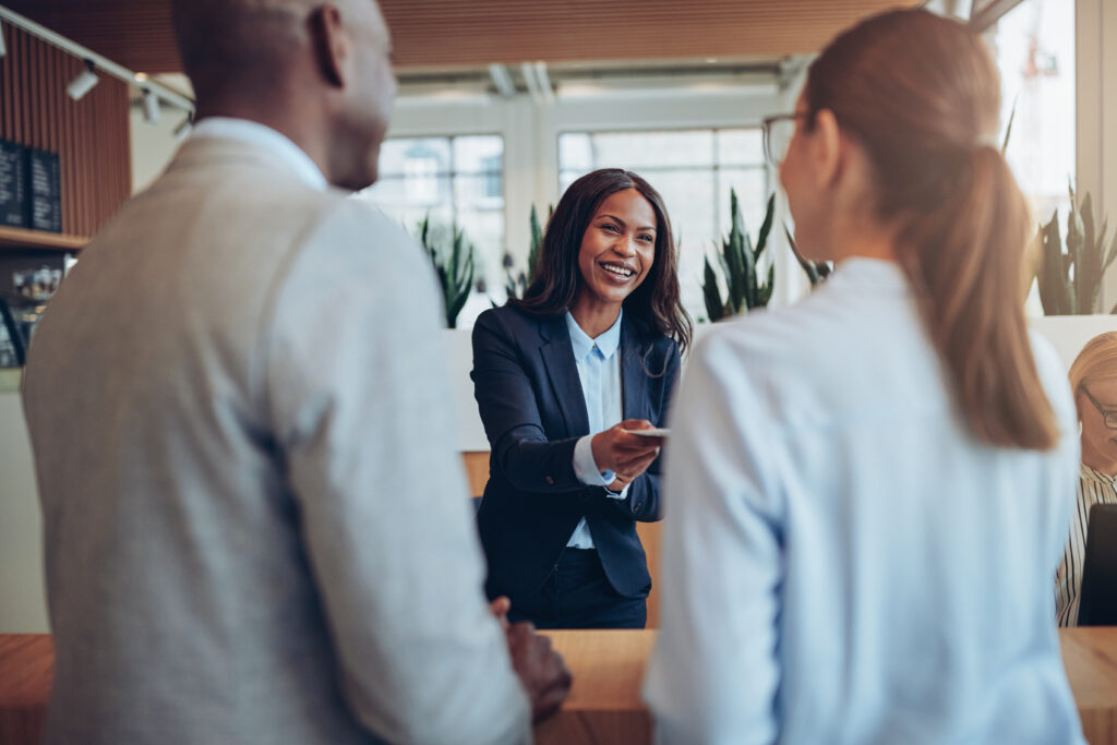 Smiling African American helping clients