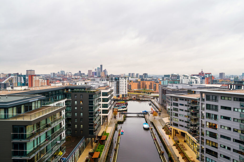 Aerial view of Leeds docks, England, UK. Heavy clouds over the modern buildings