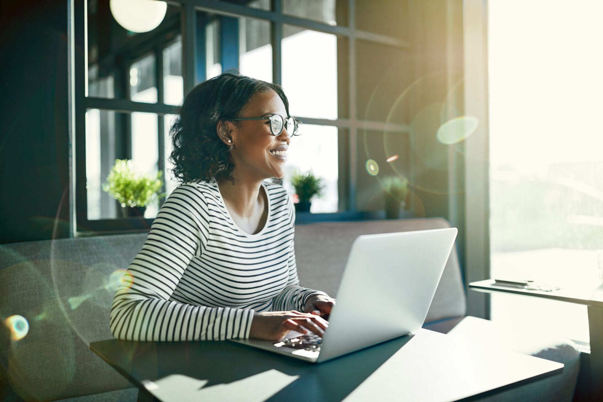 Woman on a laptop smiling