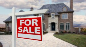 Front view of a house with a weathered For Sale sign left outside for a long time, illustrating why some homes struggle to sell