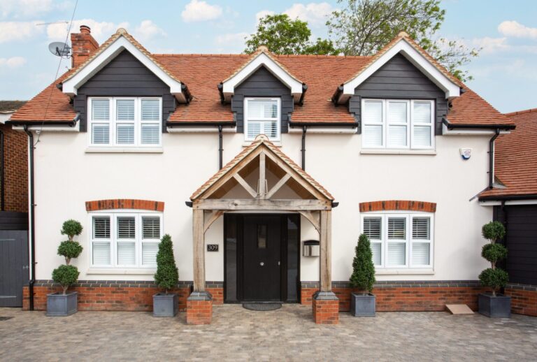 Front view of a well-maintained modern detached house in the UK, ideal for selling in 2025