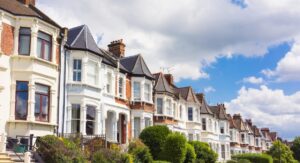 A row of Victorian terraced houses in the UK under a bright sky, representing Hunters’ 2025 tenant screening guide for landlords letting properties.