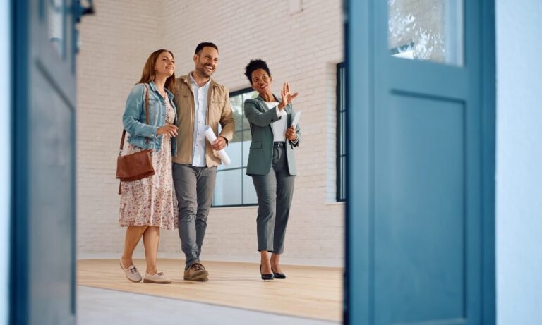 A couple viewing a rental property with an estate agent, representing landlords and tenants preparing for changes under the Renters’ Reform Act in Lichfield.