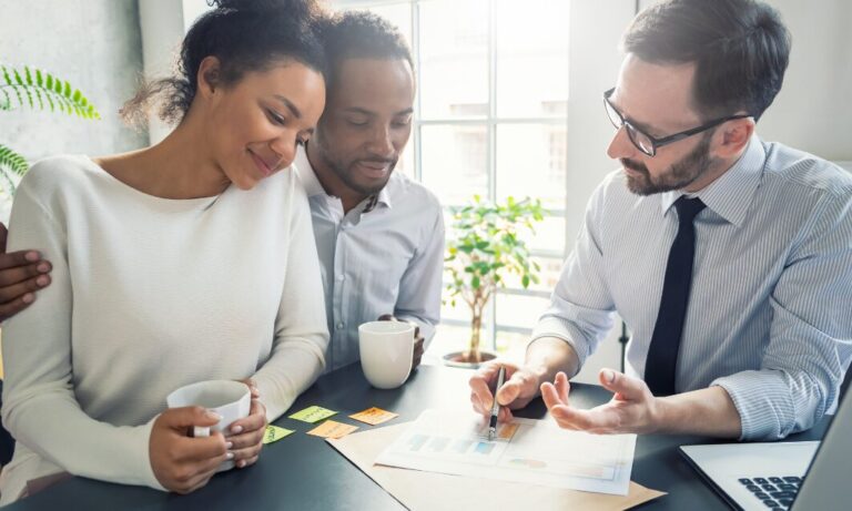 Landlords meeting with a property management adviser to review rental performance and future planning