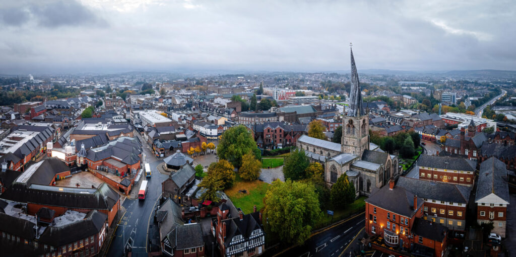 Aerial view of Chesterfield town centre featuring the Crooked Spire and surrounding residential areas