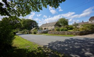 Stone cottages and village street in Skipton, Yorkshire Dales, showcasing the town’s character and community setting