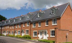 Modern UK terraced houses on a quiet residential street, reflecting the property market in 2026.