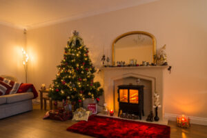 Elegant luxury living room in Solihull decorated for Christmas, showcasing a fireplace, festive lighting and warm winter ambience ideal for high-end property marketing