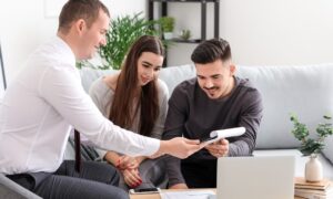 Letting agent explaining property management and compliance changes to self-managing landlords