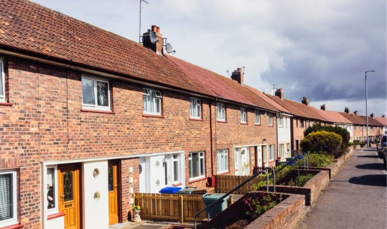 Row of traditional UK terraced houses in a residential neighbourhood