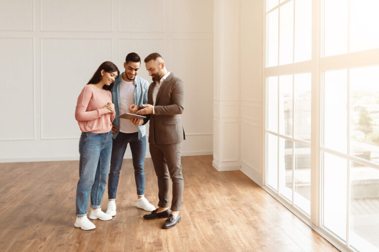 Letting agent showing a bright two-bedroom property to two professional tenants in Harborne in 2026