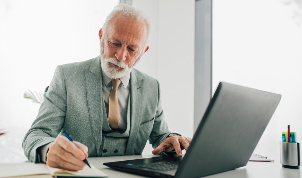 Landlord reviewing documents and drafting a Section 13 rent increase notice under the Renters’ Rights Act 2025