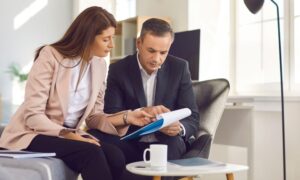 Estate agent discussing Skipton’s £7.2m Town Investment Plan with a homeowner, explaining how regeneration and public realm upgrades may affect home value in 2026