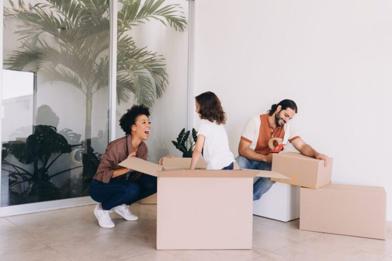 Family unpacking boxes in a new build home in Tamworth, reflecting modern living at developments like Arkall Farm in 2026