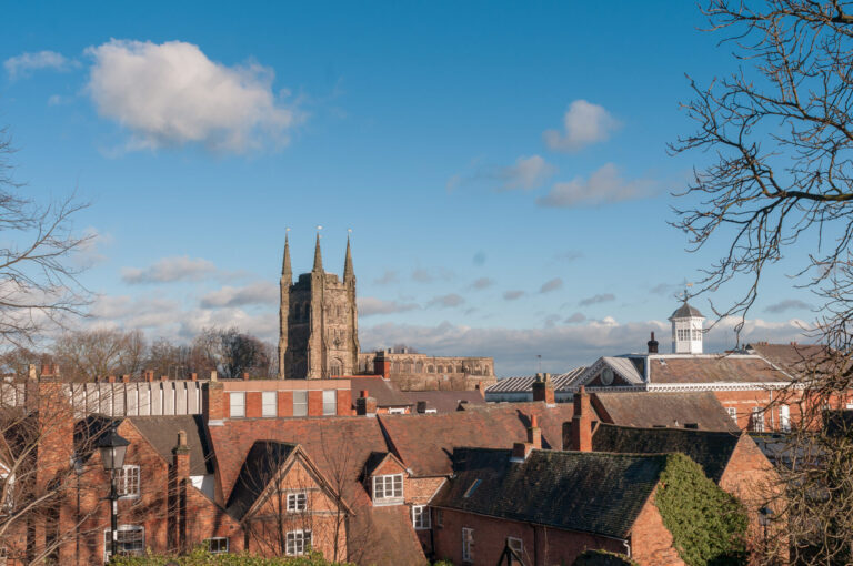 View of Tamworth skyline with historic church tower and traditional red-brick homes near Fazeley along the B78 corridor