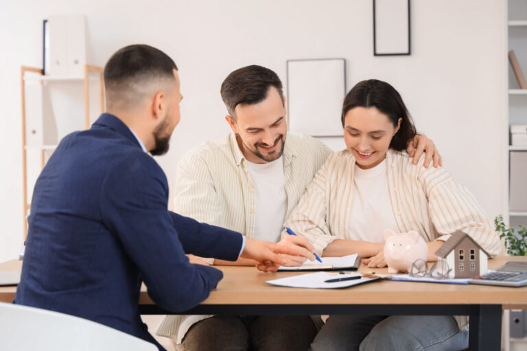 Landlord meeting with property agent to review rental licensing compliance documents in Gravesend