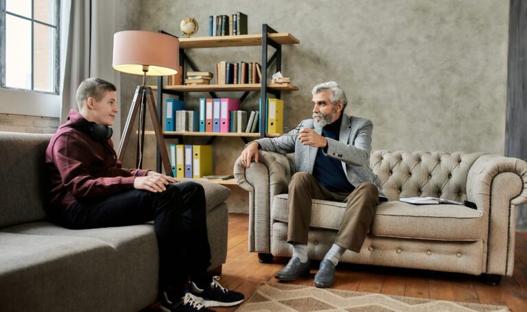 landlord discussing tenancy terms with tenant in living room