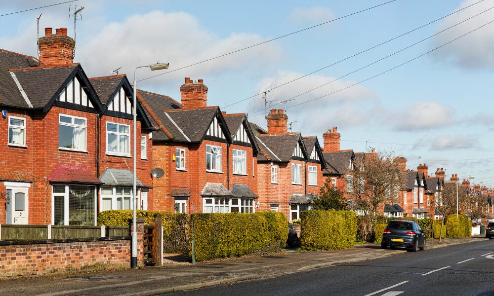 Row of red-brick detached houses on a residential street in Harrogate, reflecting strong demand for spacious homes in the 2026 property market