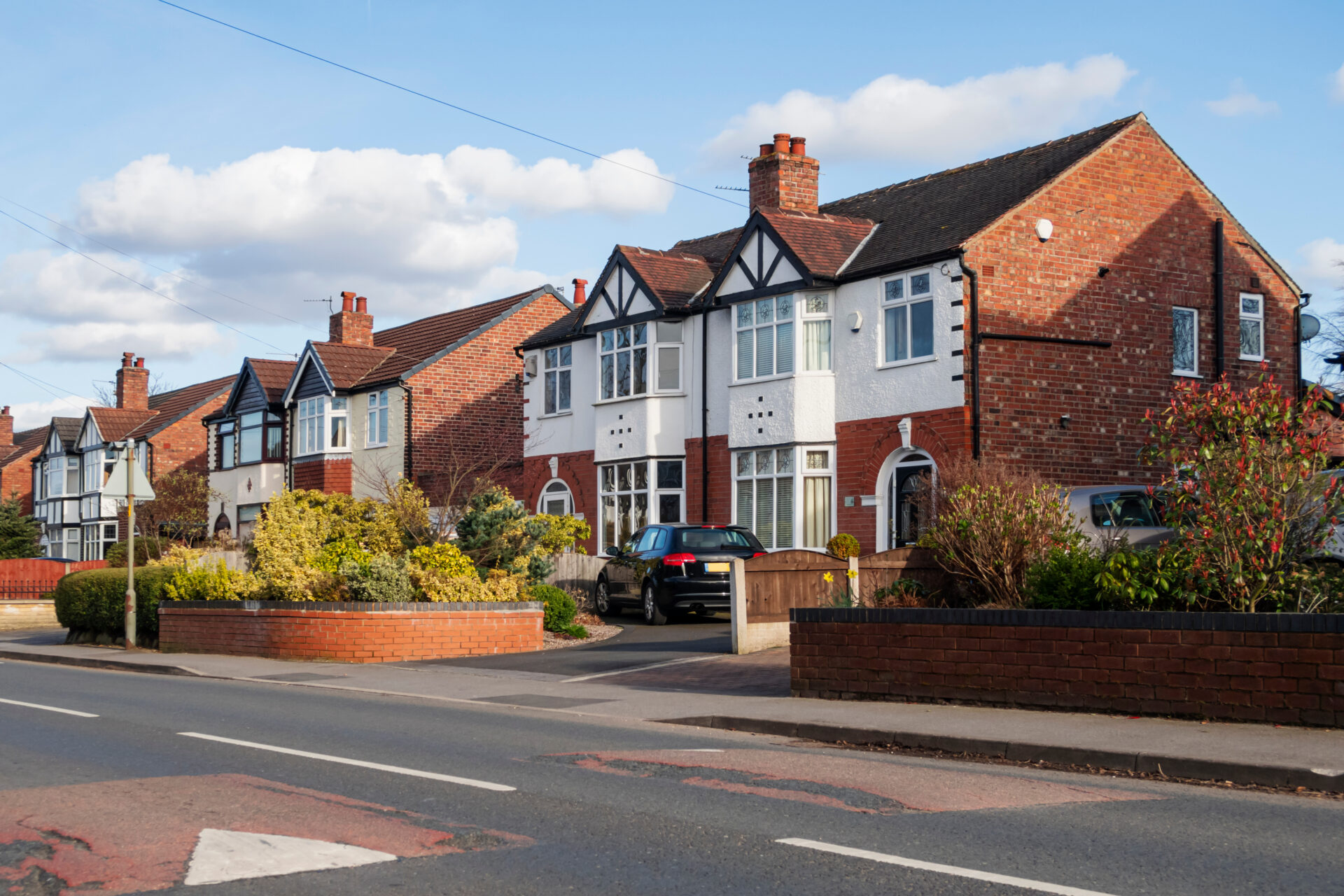 Row of detached and semi-detached houses on suburban street, representing house valuation in Chesterfield