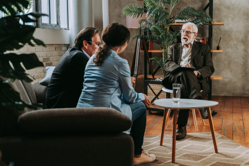 landlord discussing tenancy terms with tenant in living room