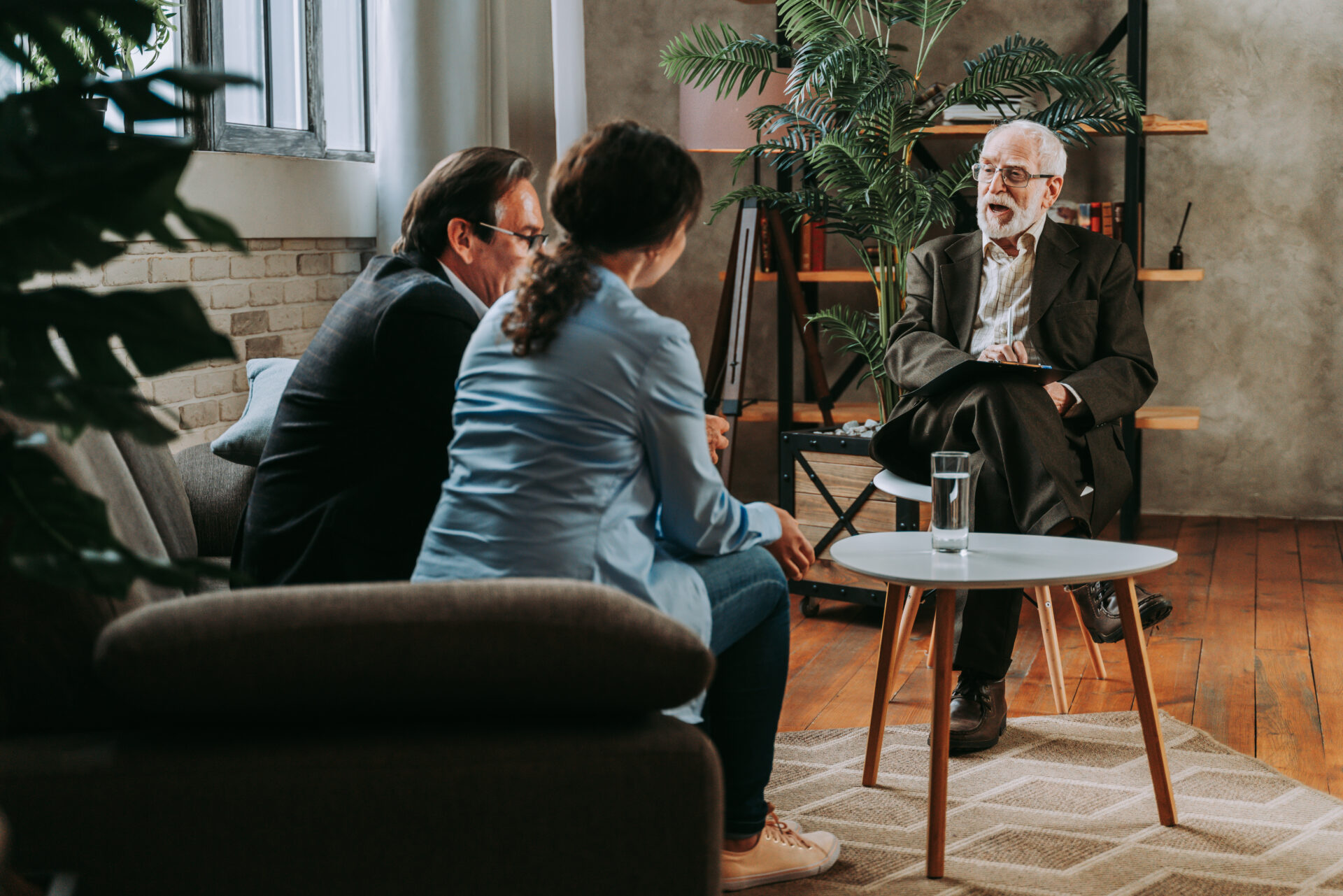 landlord discussing tenancy terms with tenant in living room