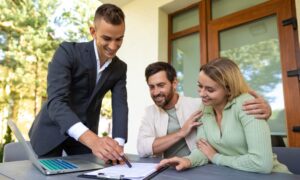 Landlord discussing tenancy agreement with couple, reflecting Renters Rights Act Knowle B93 changes