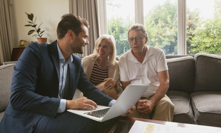 Estate agent discussing property options with couple in a home in Pannal Harrogate
