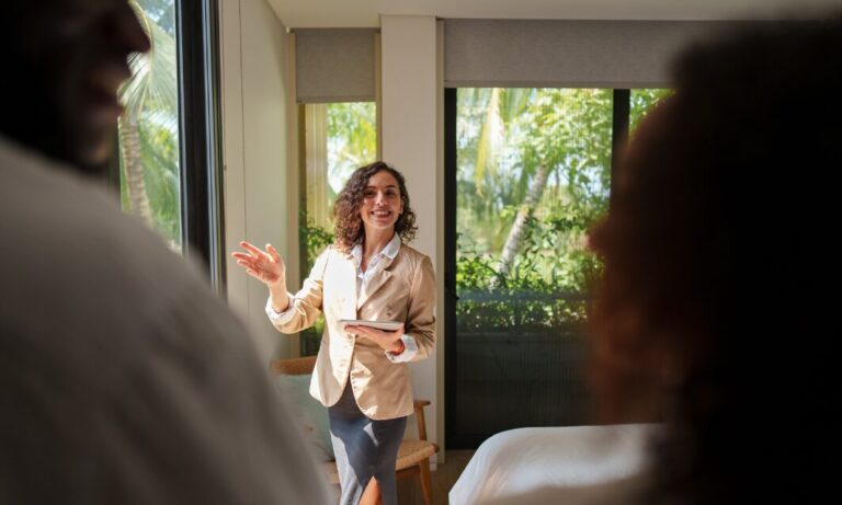 Letting agent presenting a rental property to prospective tenants in Kirkstall Leeds