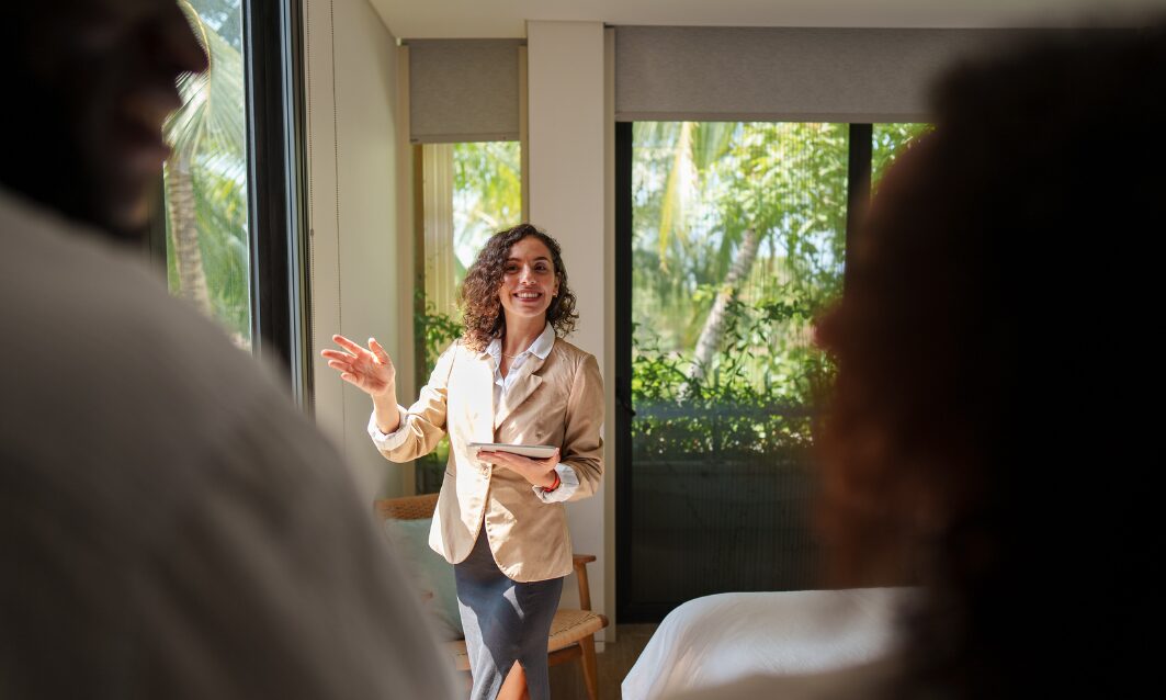 Letting agent presenting a rental property to prospective tenants in Kirkstall Leeds