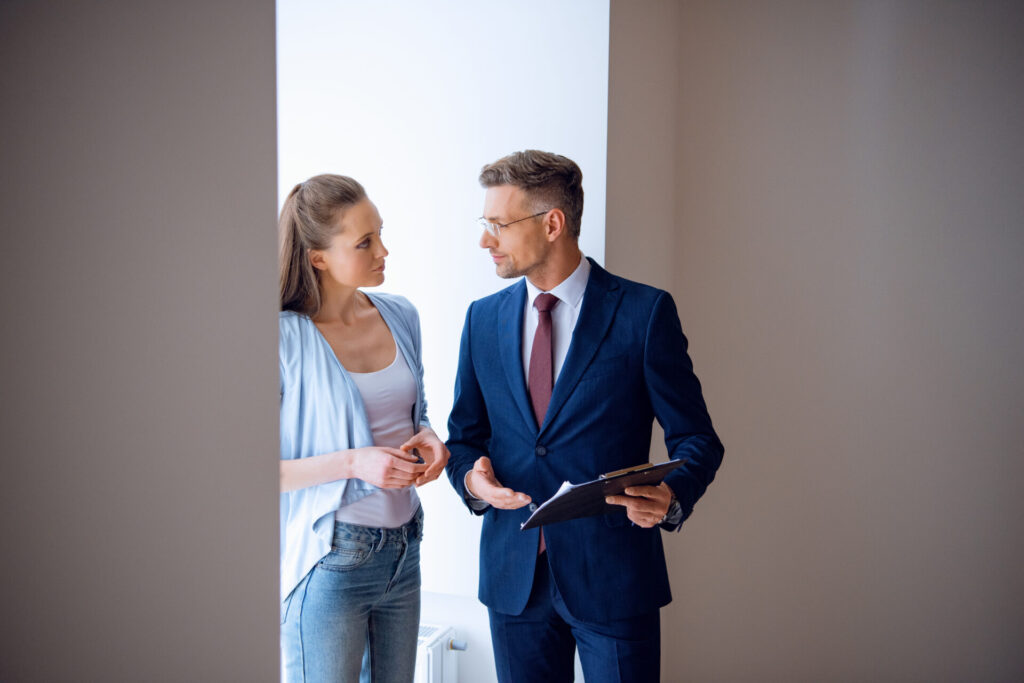estate agent discussing property details with buyer in Carlisle home viewing