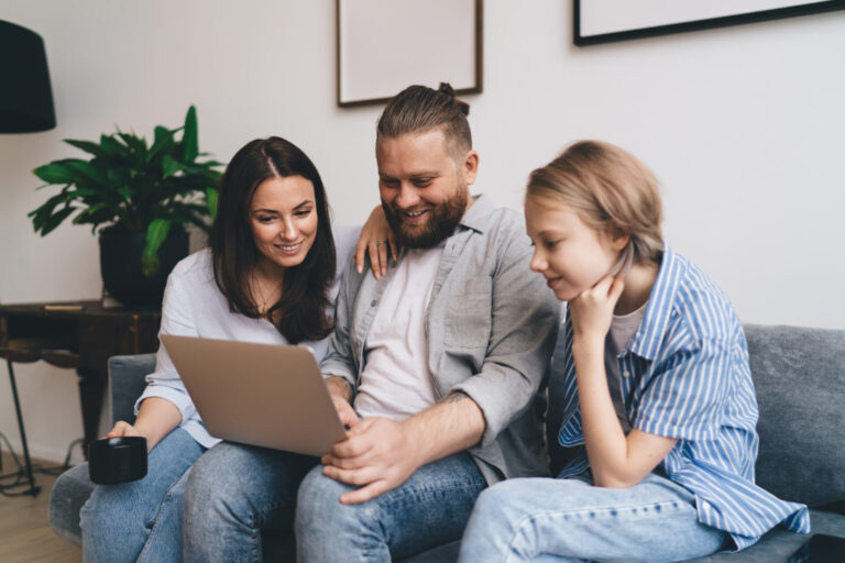 couple reviewing property documents with estate agent advice in modern home setting