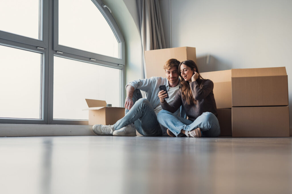 family discussing property purchase with estate agent during home viewing in Dumfries