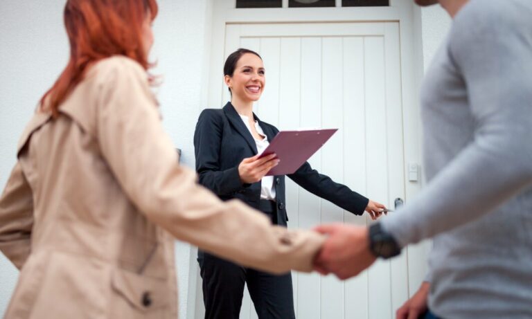 Estate agent greeting couple during property viewing in Dorridge B93