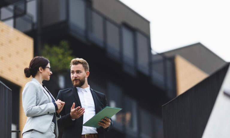 Letting agent discussing property regulations and compliance with landlord in Dumfries