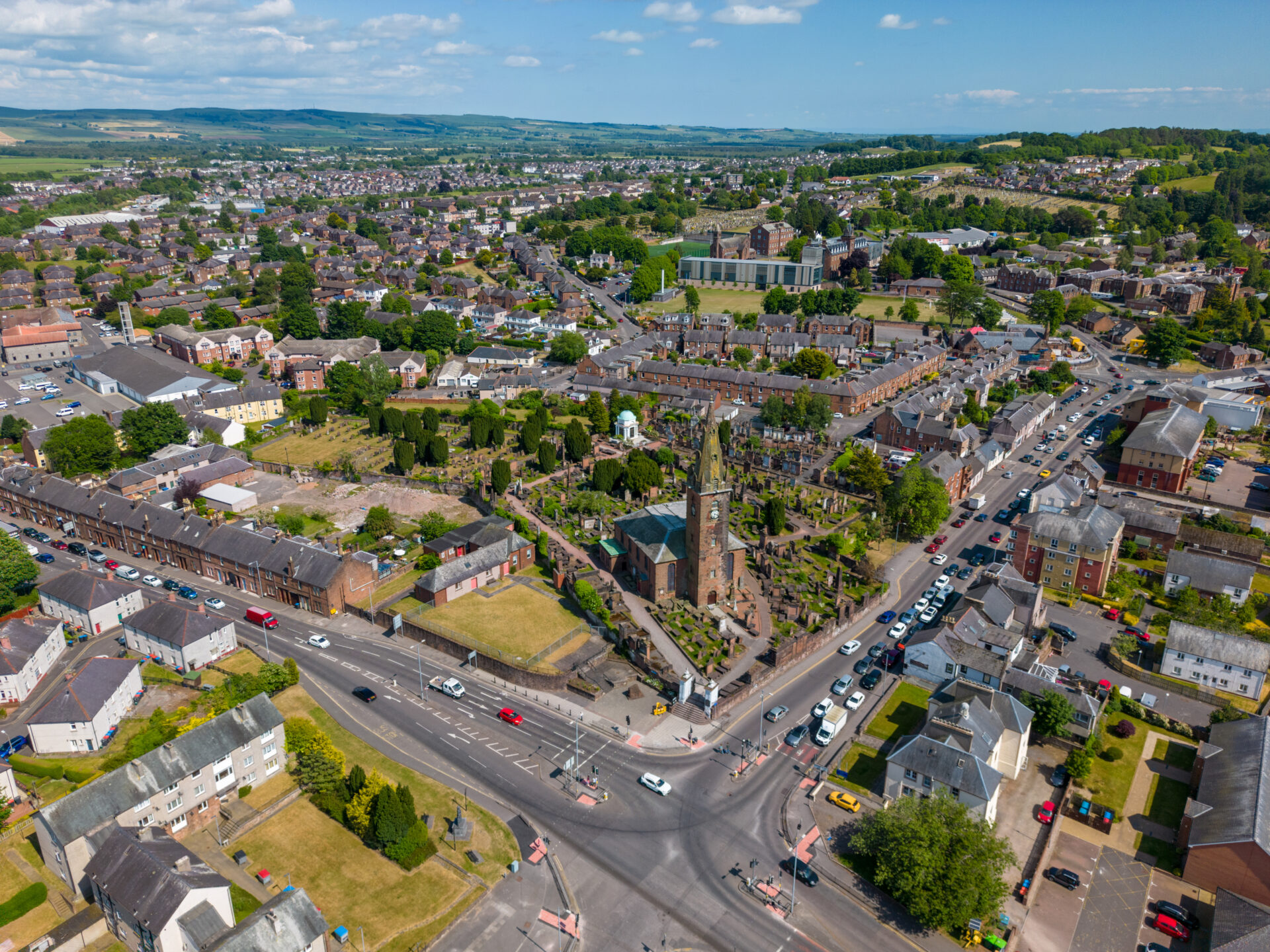 Drone view overlooking Dumfries town centre, residential streets and surrounding neighbourhoods in Dumfries and Galloway.