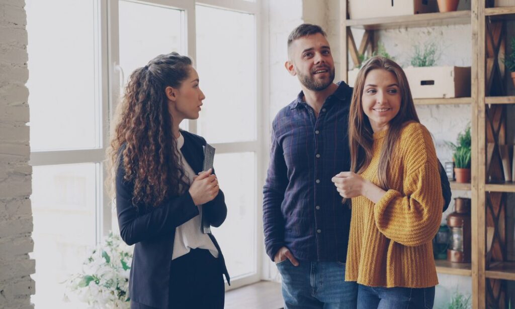 Estate agent showing a property to a couple in Harborne Birmingham
