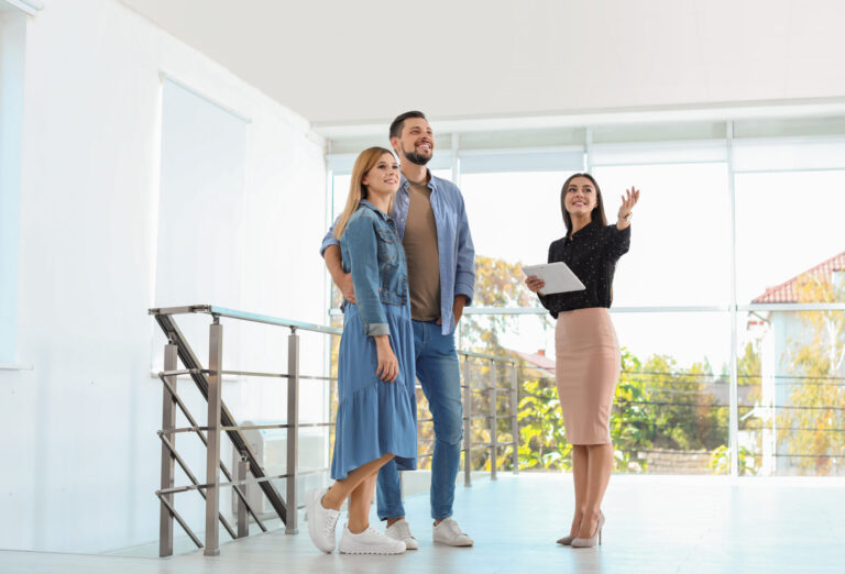 Estate agent showing a property to a couple in Stanmore HA7