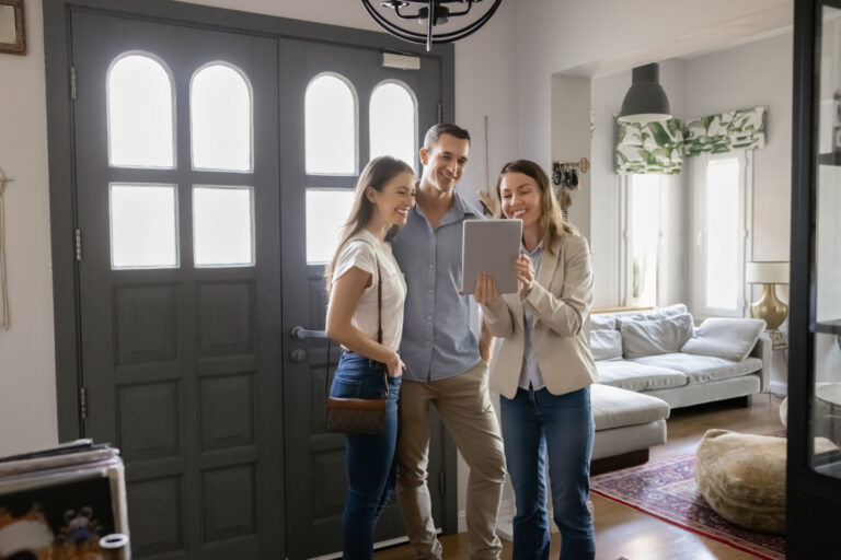 Letting agent showing a modern rental home to tenants in Manchester