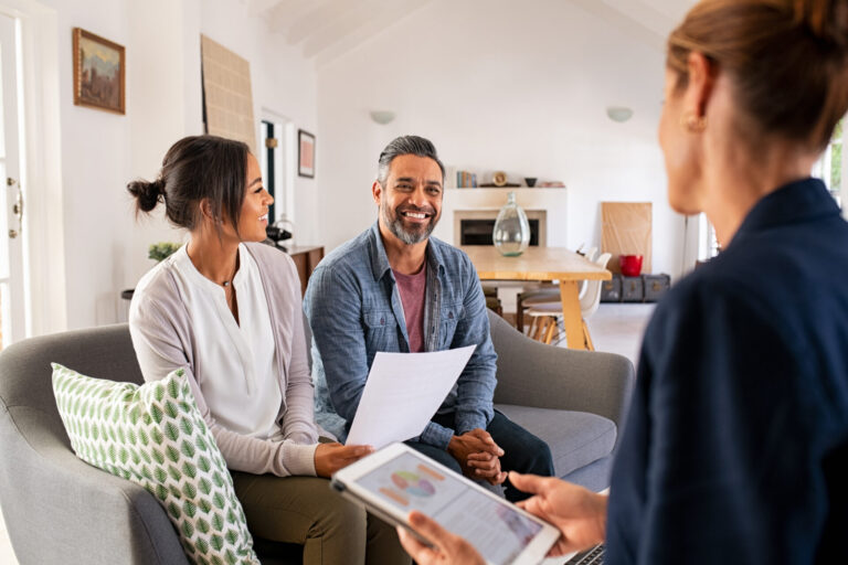 Property adviser discussing rental investment with a couple, representing Chesterfield buy-to-let yields and landlord opportunities.