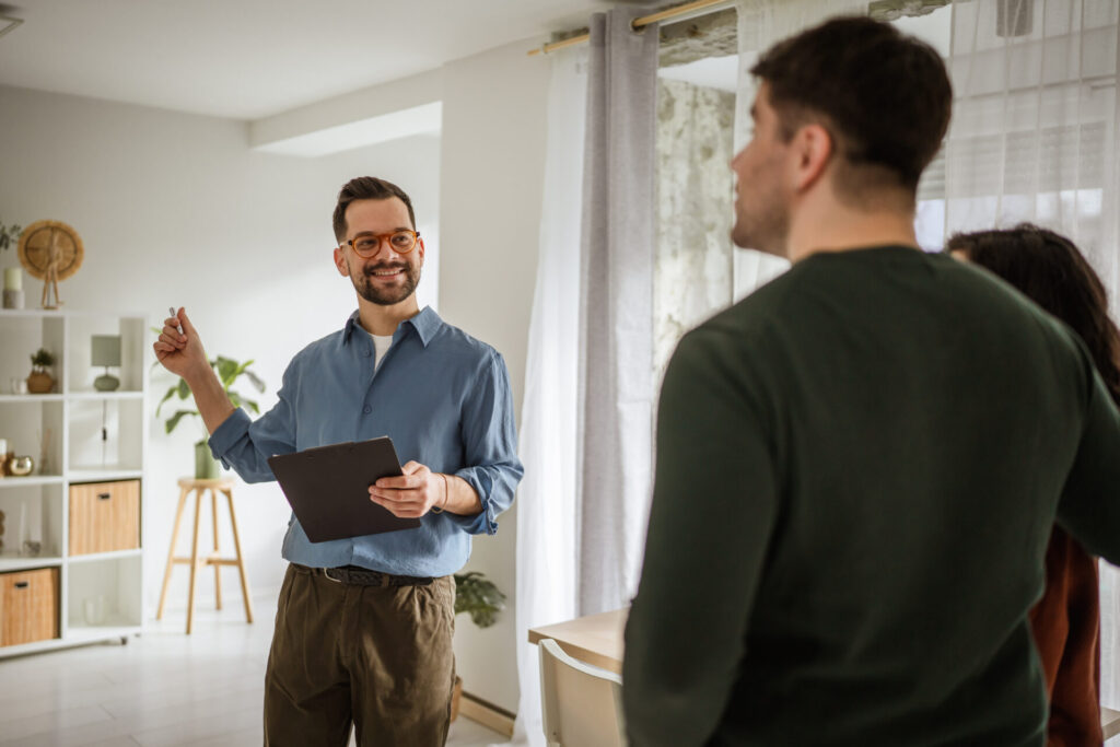 Estate agent discussing Bradford house prices and property valuations with homeowners