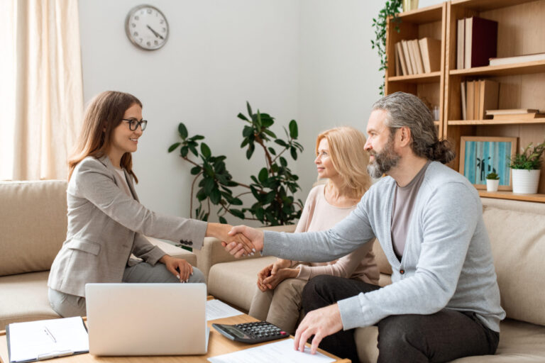 Property adviser shaking hands with a landlord, representing Bridgend rental yields, landlord guidance and tax changes in 2026.