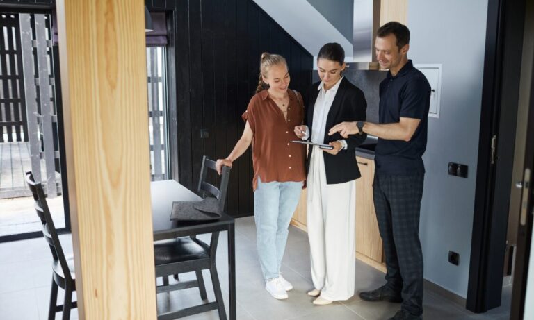 Letting agent showing a couple around a modern rental property, representing Camberwell rental market demand and landlord yields in SE5.