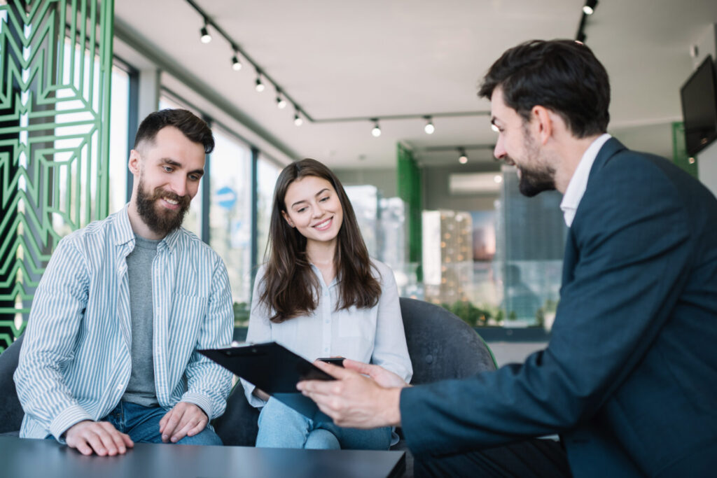 Estate agent discussing Gravesend property prices and buying opportunities with a couple