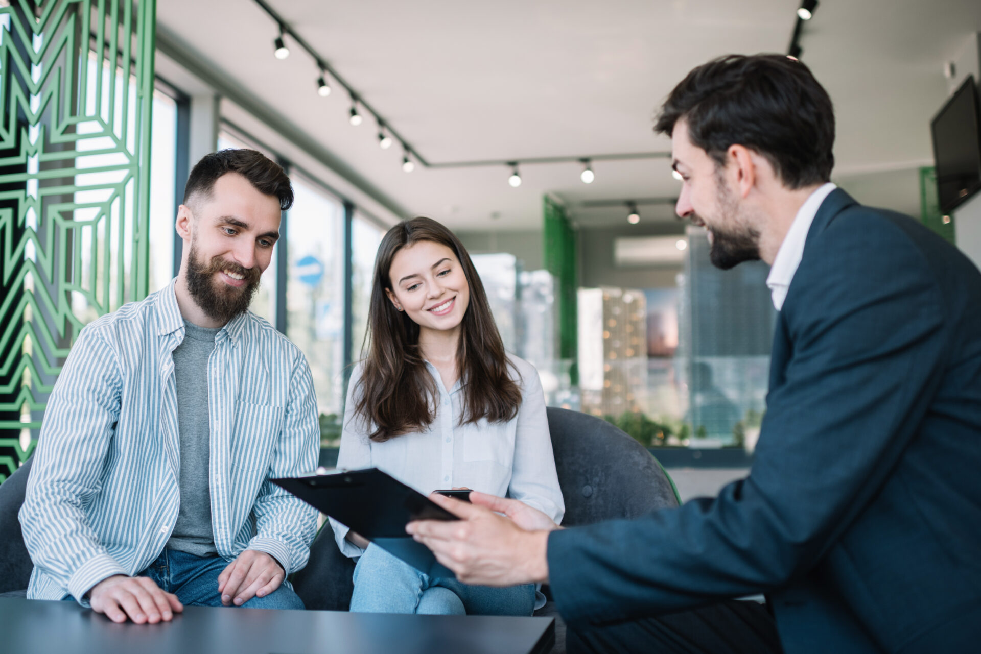 Estate agent discussing Gravesend property prices and buying opportunities with a couple