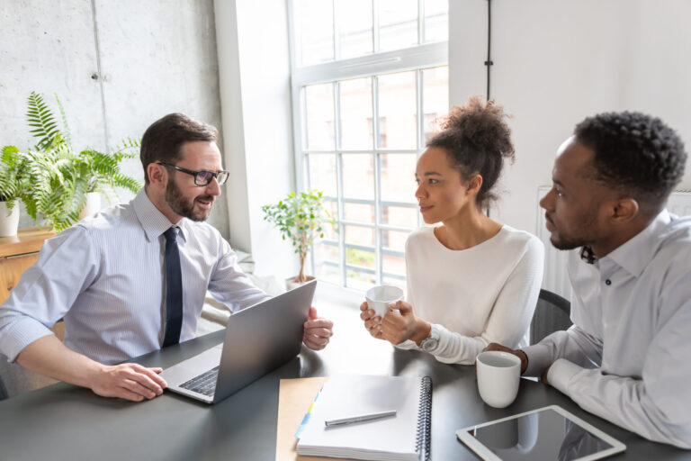 Homebuyers discussing property options with an estate agent in Southampton, reflecting local house prices and neighbourhood demand in 2026.