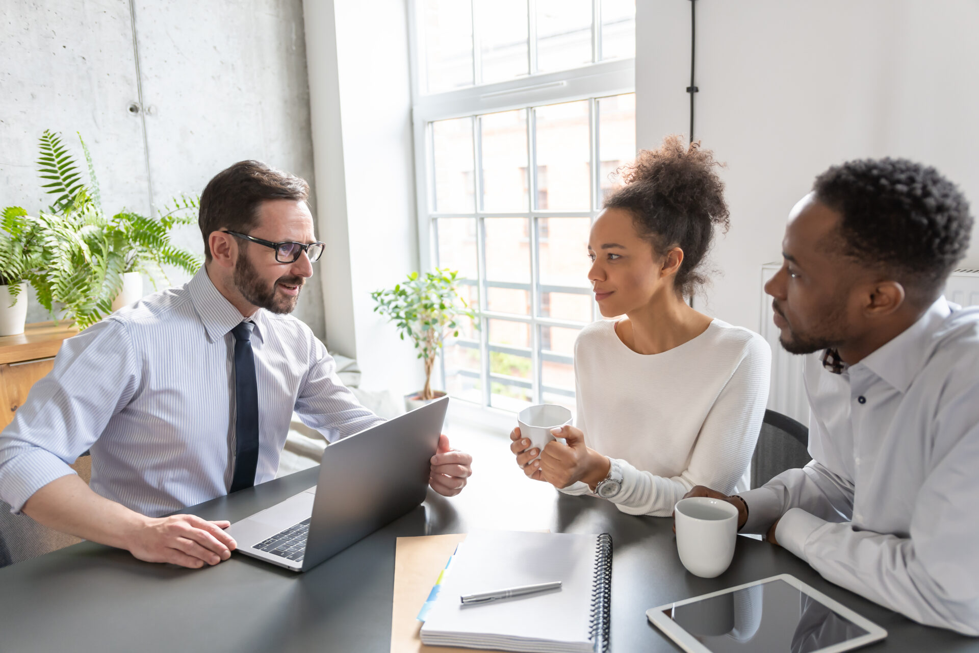Homebuyers discussing property options with an estate agent in Southampton, reflecting local house prices and neighbourhood demand in 2026.