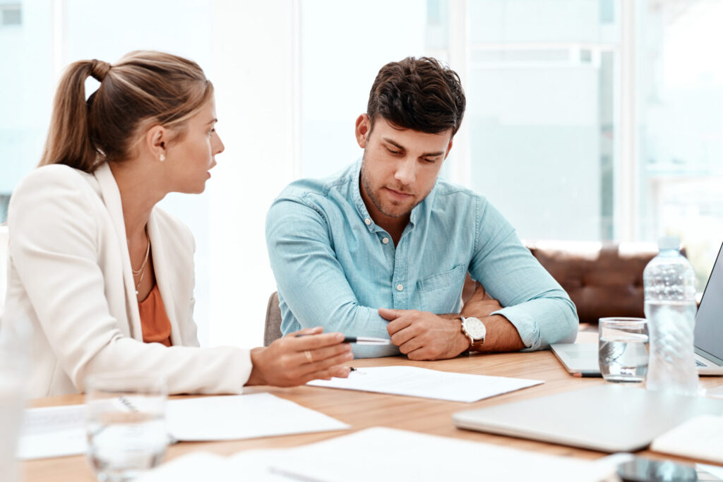 Landlord and tenant reviewing tenancy documents during a property management meeting in Skipton following the introduction of periodic tenancies in 2026.