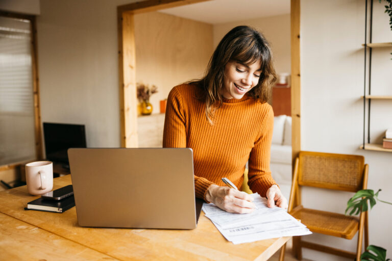 Landlord working from home reviewing tenancy documents and compliance paperwork for a growing property portfolio in Southampton.